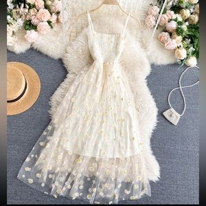 White daisy print mesh overlay dress with spaghetti straps, midi length